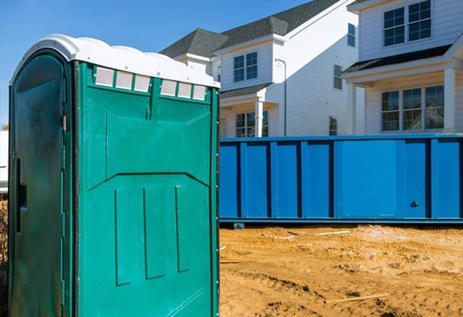 porta potties on a busy work site, providing necessary facilities